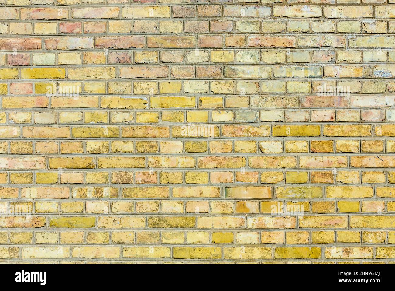 old vintage yellow brick wall as harmonic background Stock Photo - Alamy