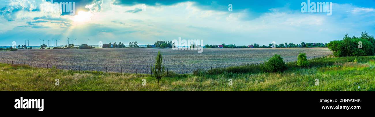 wind turbines in rural area under blue sky Stock Photo - Alamy
