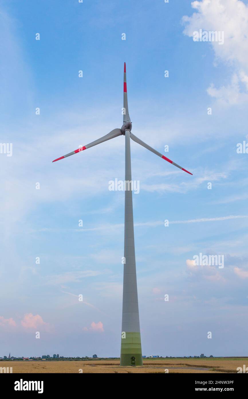 wind turbine in rural area under blue sky Stock Photo - Alamy
