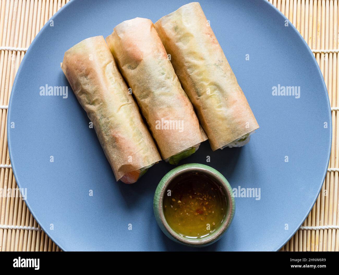 top view of wrapped Nem Cuon, Vietnamese fresh spring rolls on gray blue plate Stock Photo