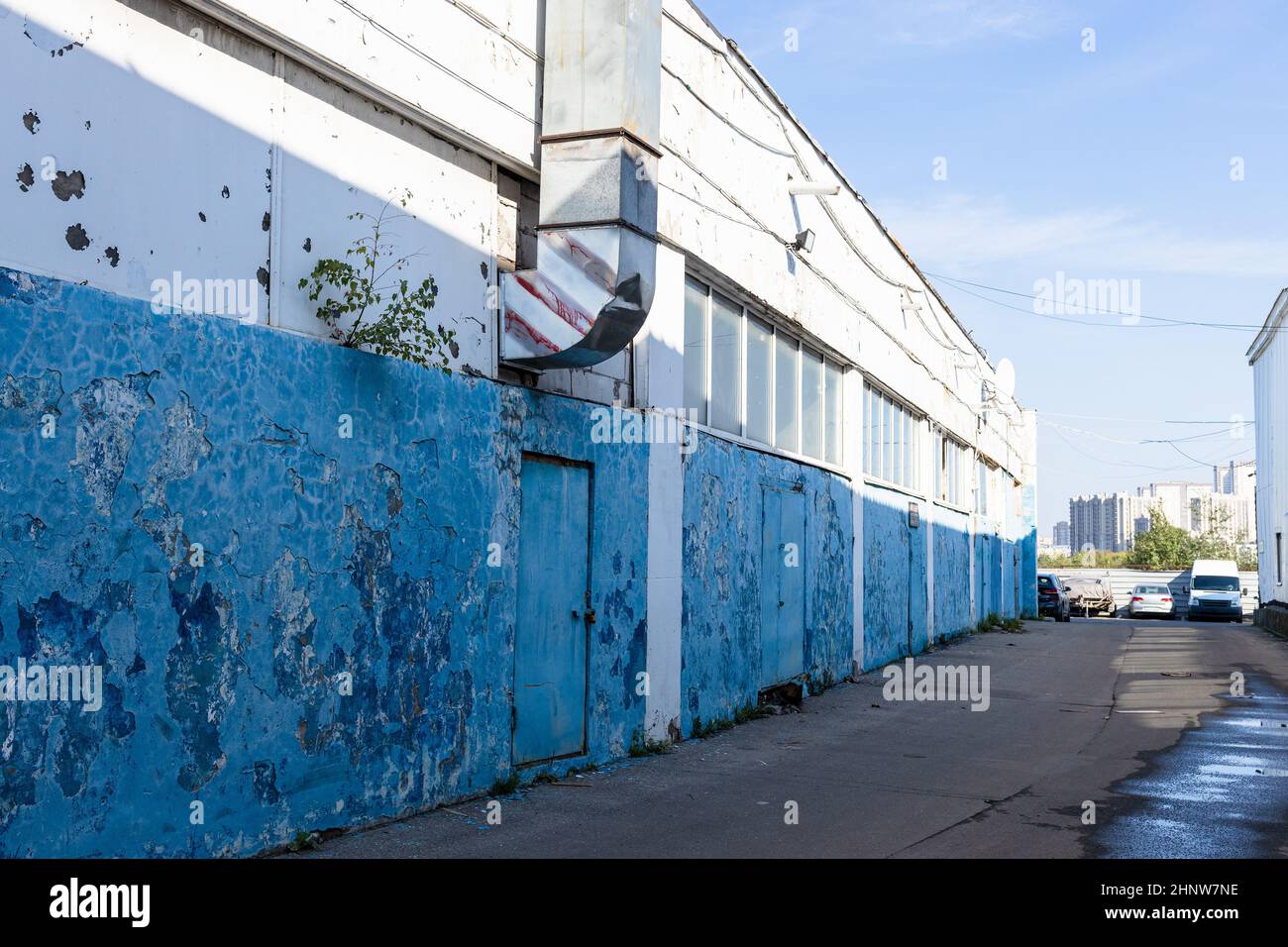 shabby painted walls of warehouse in summer morning Stock Photo Alamy