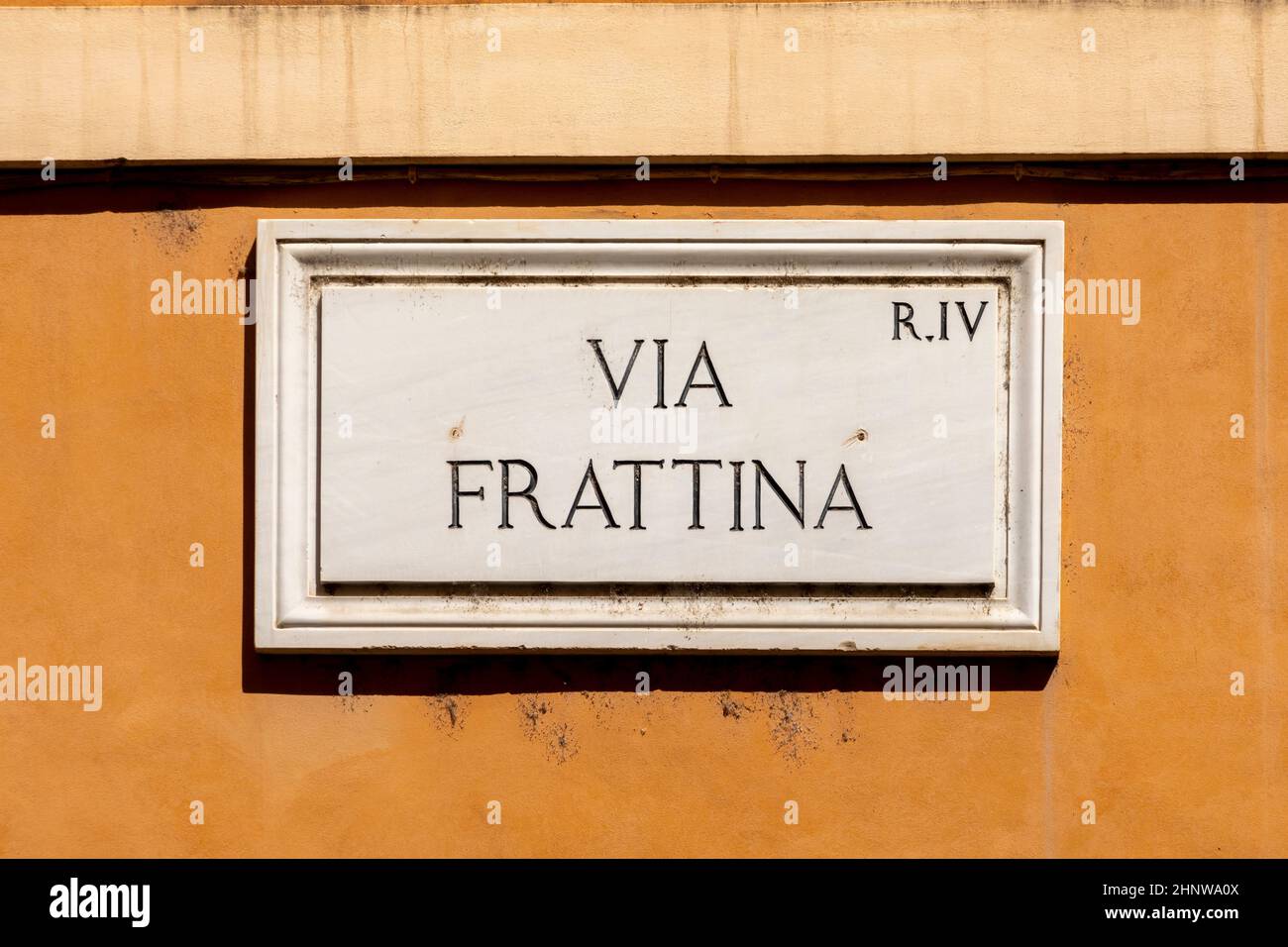 marble plate with Street name via Frattina - engl: Fattina street - painted at the wall in Rome, Italy Stock Photo