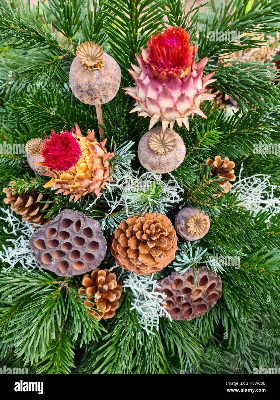 Selective focus of a beautiful arrangement of fir branches and cones at ...