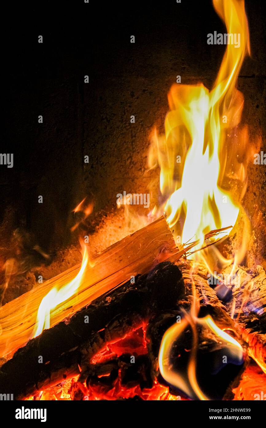Romantic bright open fire on wood in a hut in Norway. Stock Photo