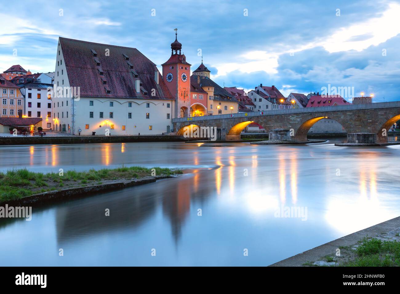 Night Stone Bridge and Old Town of Regensburg, Bavaria, Germany Stock Photo