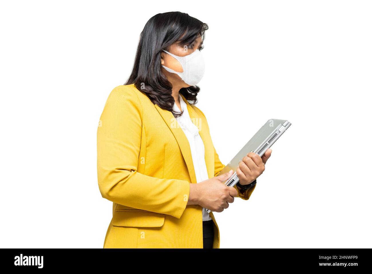 Business asian lady wearing face mask holding laptop isolated on white ...