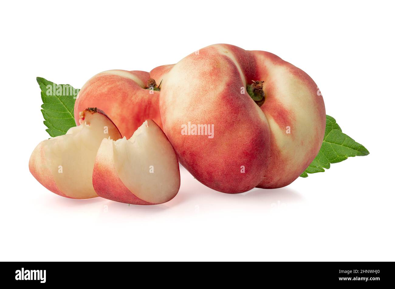 Donut peaches with leaf isolated on white with clipping path. Stock Photo