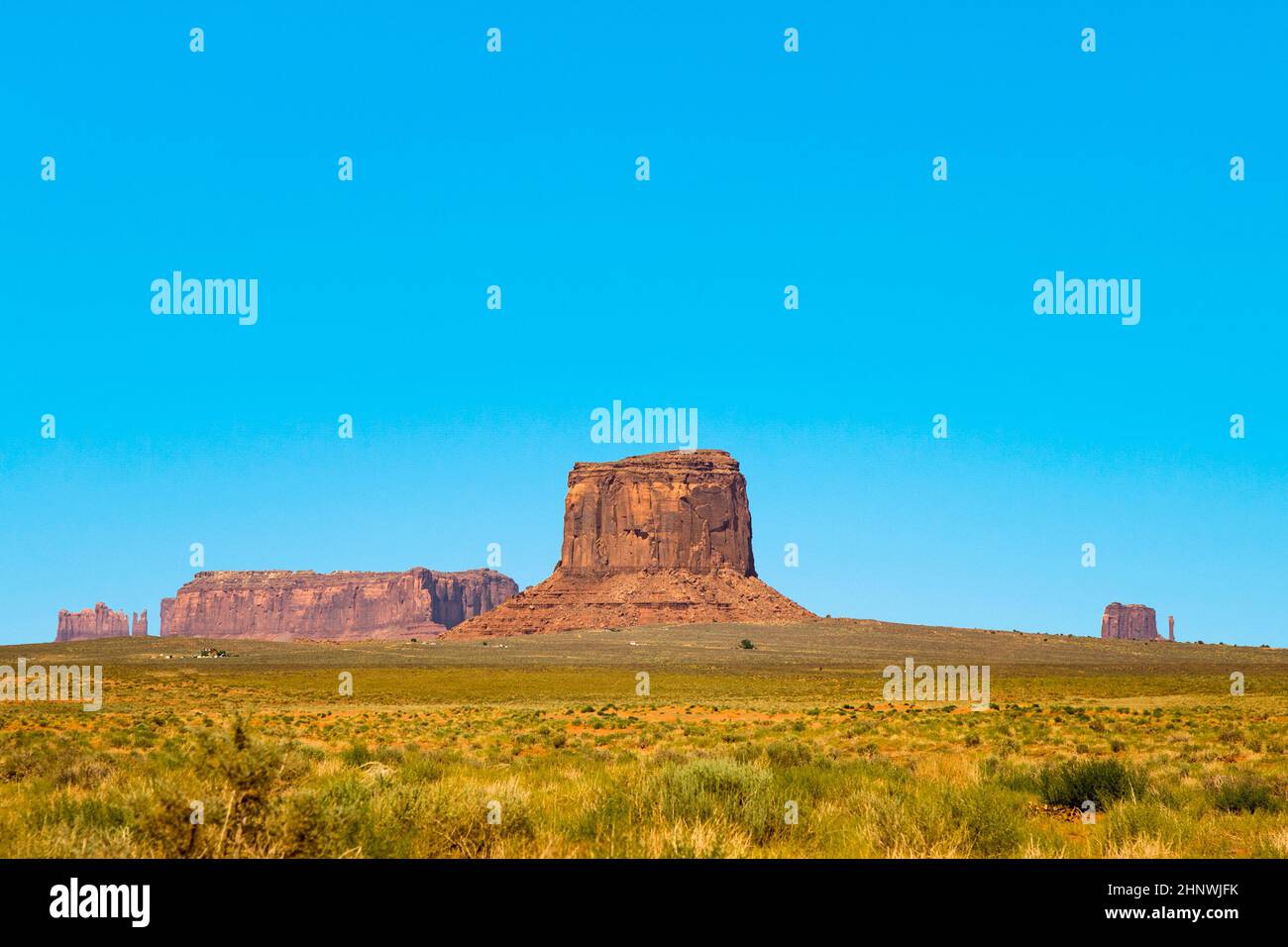 giant sandstone formation in the Monument valley under blue sky Stock ...