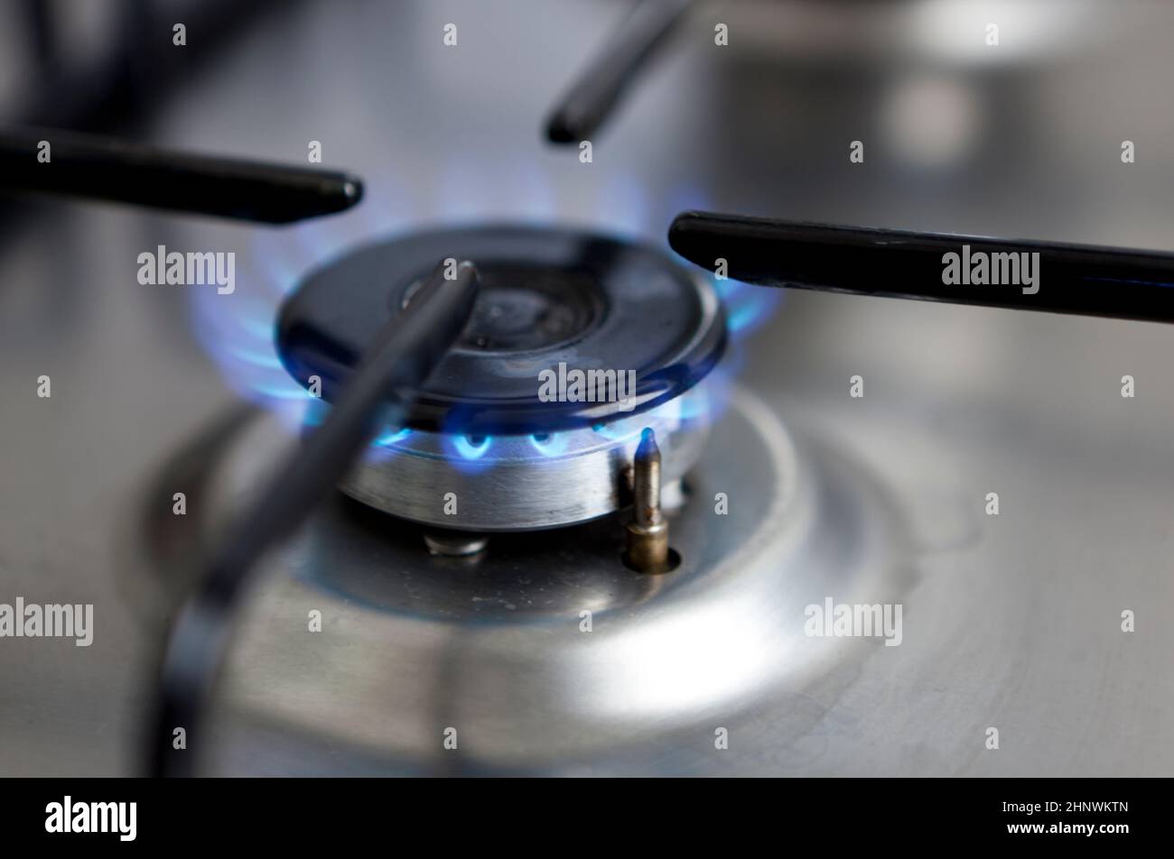 The photo shows a blue glowing gas flame at a stove Stock Photo Alamy