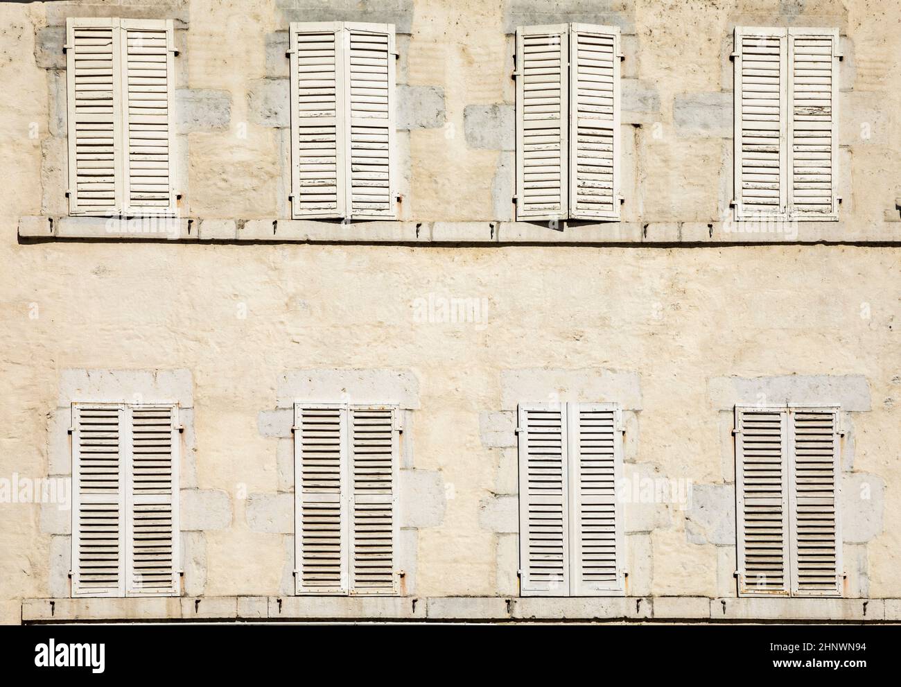 old house facade with eight closed shutters in white Stock Photo - Alamy