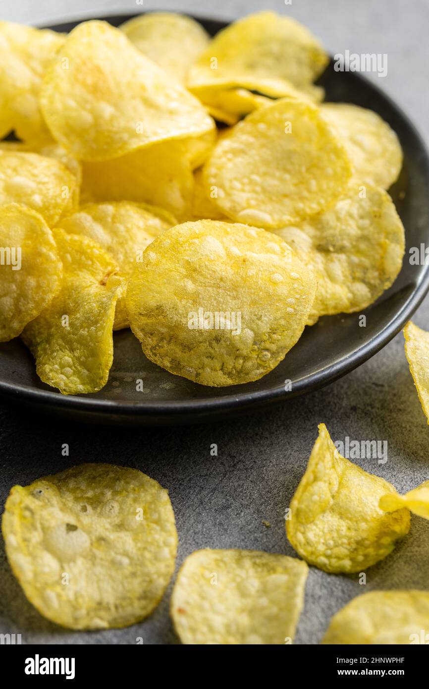 Crunchy potato chips. Potato crisps on plate Stock Photo Alamy