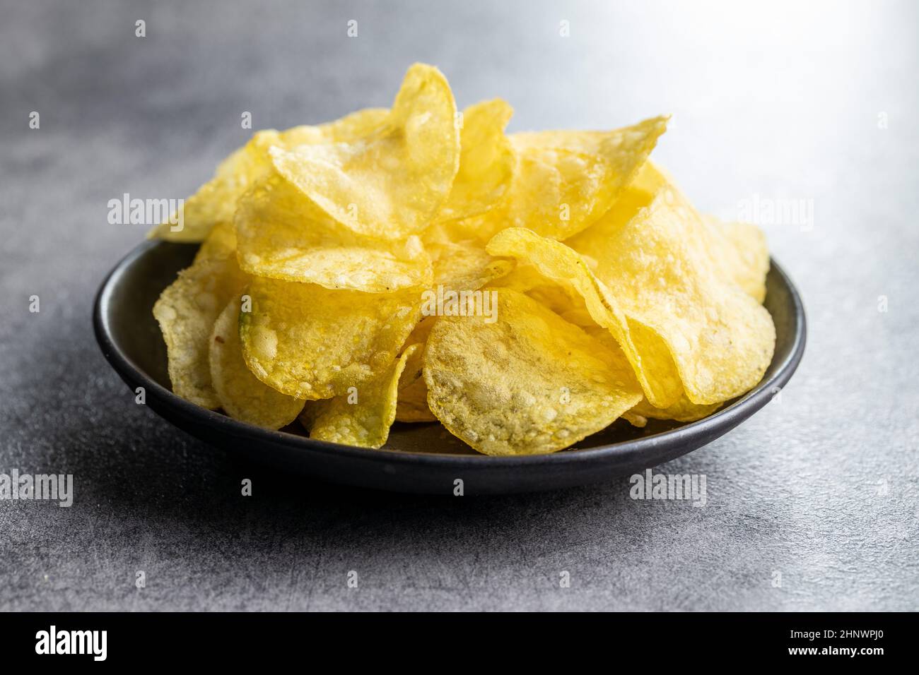Crunchy potato chips. Potato crisps on plate Stock Photo Alamy