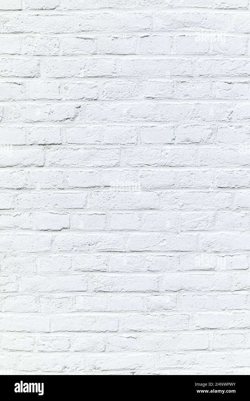 old white brick wall painted in white as harmonic background Stock Photo