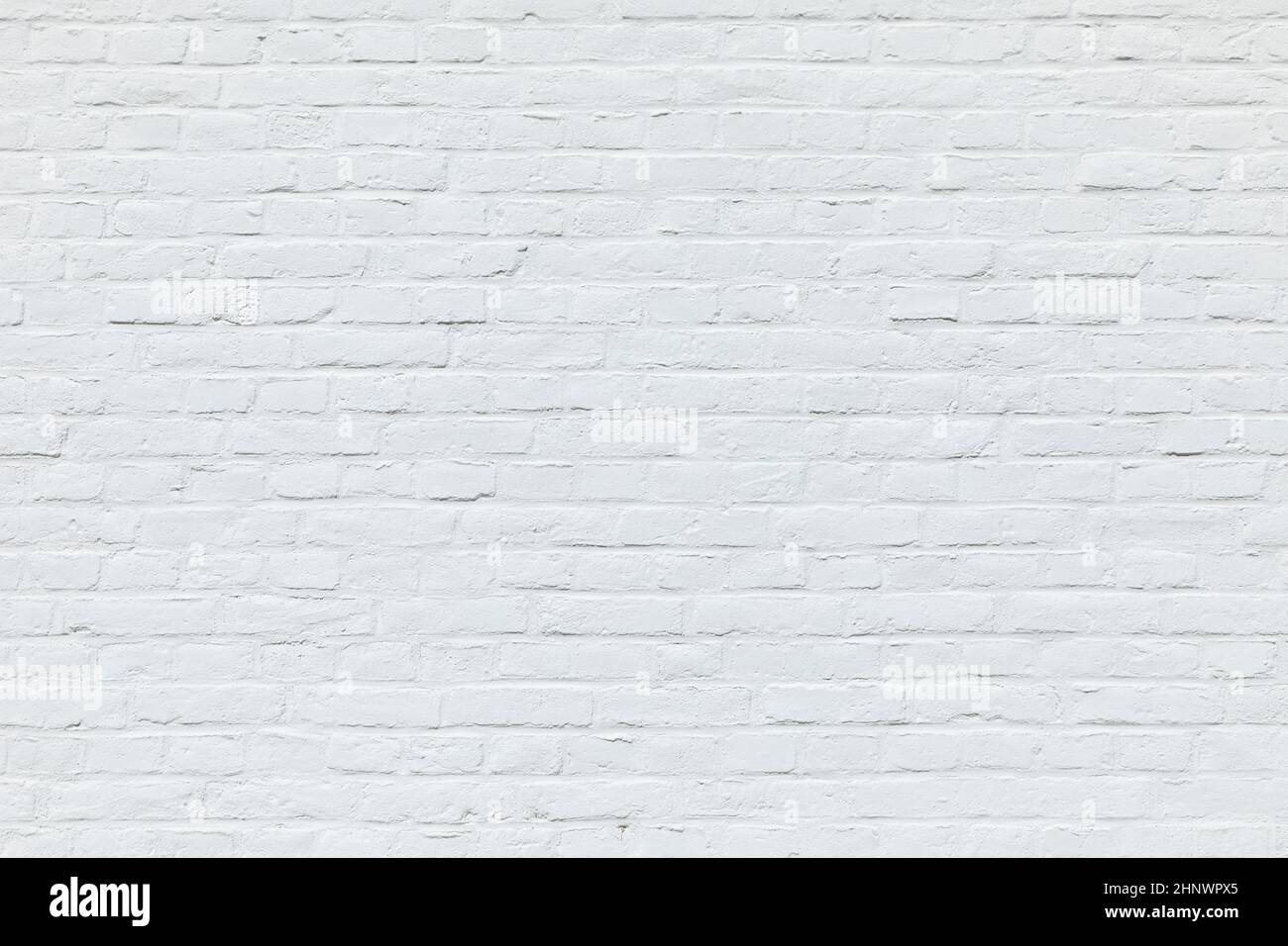 old white brick wall painted in white as harmonic background Stock Photo