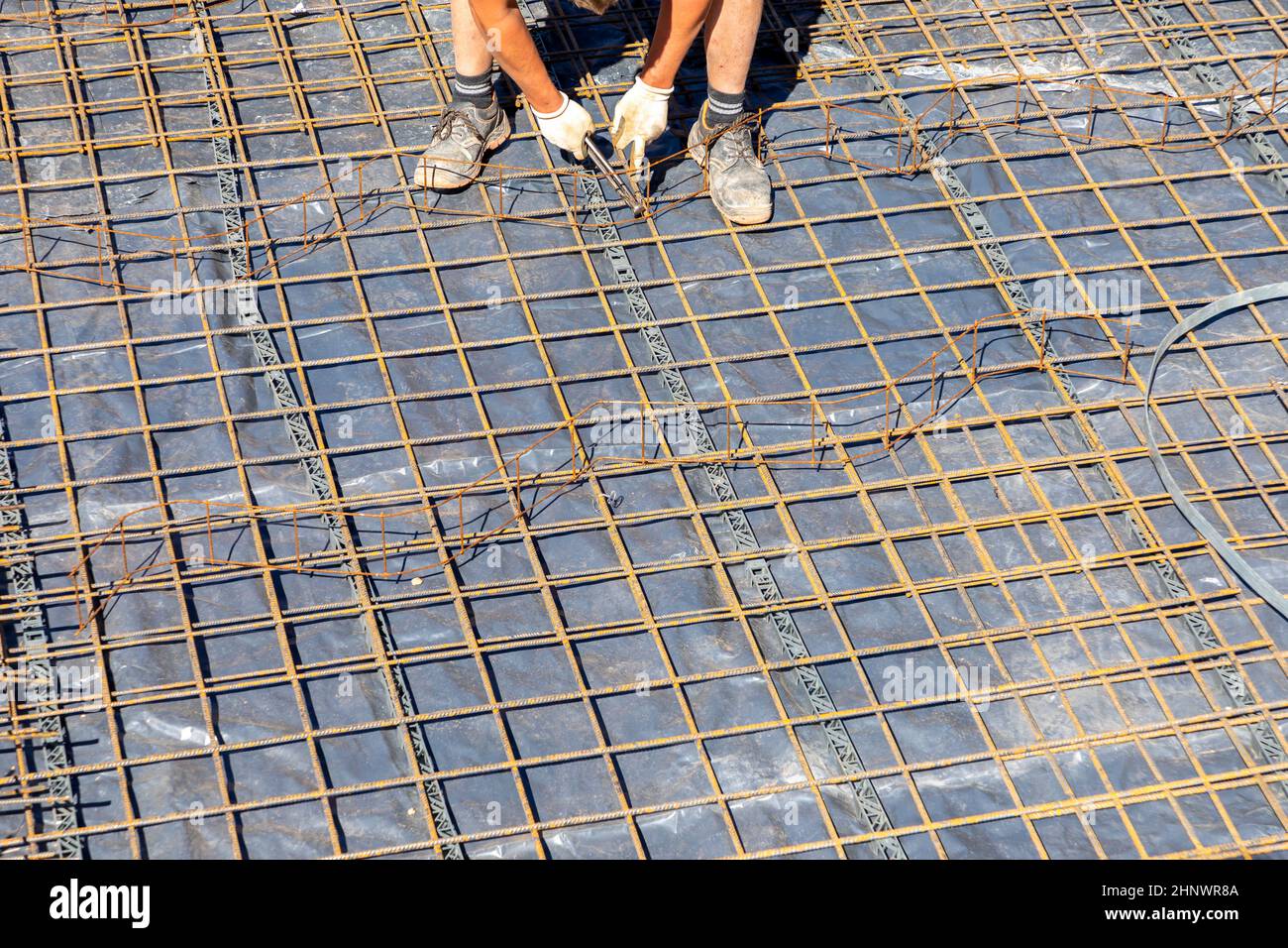 hands of man working on the iron rod for the concrete foundation Stock ...