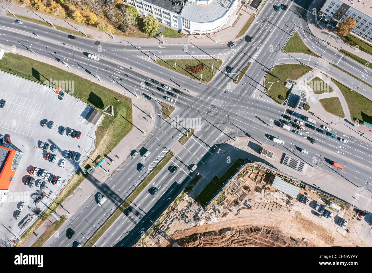 aerial view of crossroad with car traffic in industrial zone. city infrastructure from above. Stock Photo