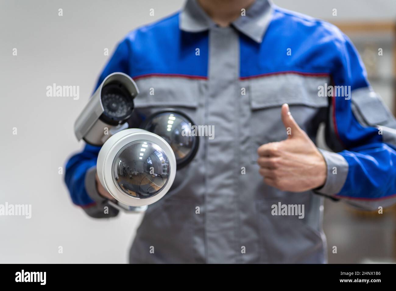 Technician Using Surveillance Security Camera Video System Stock Photo