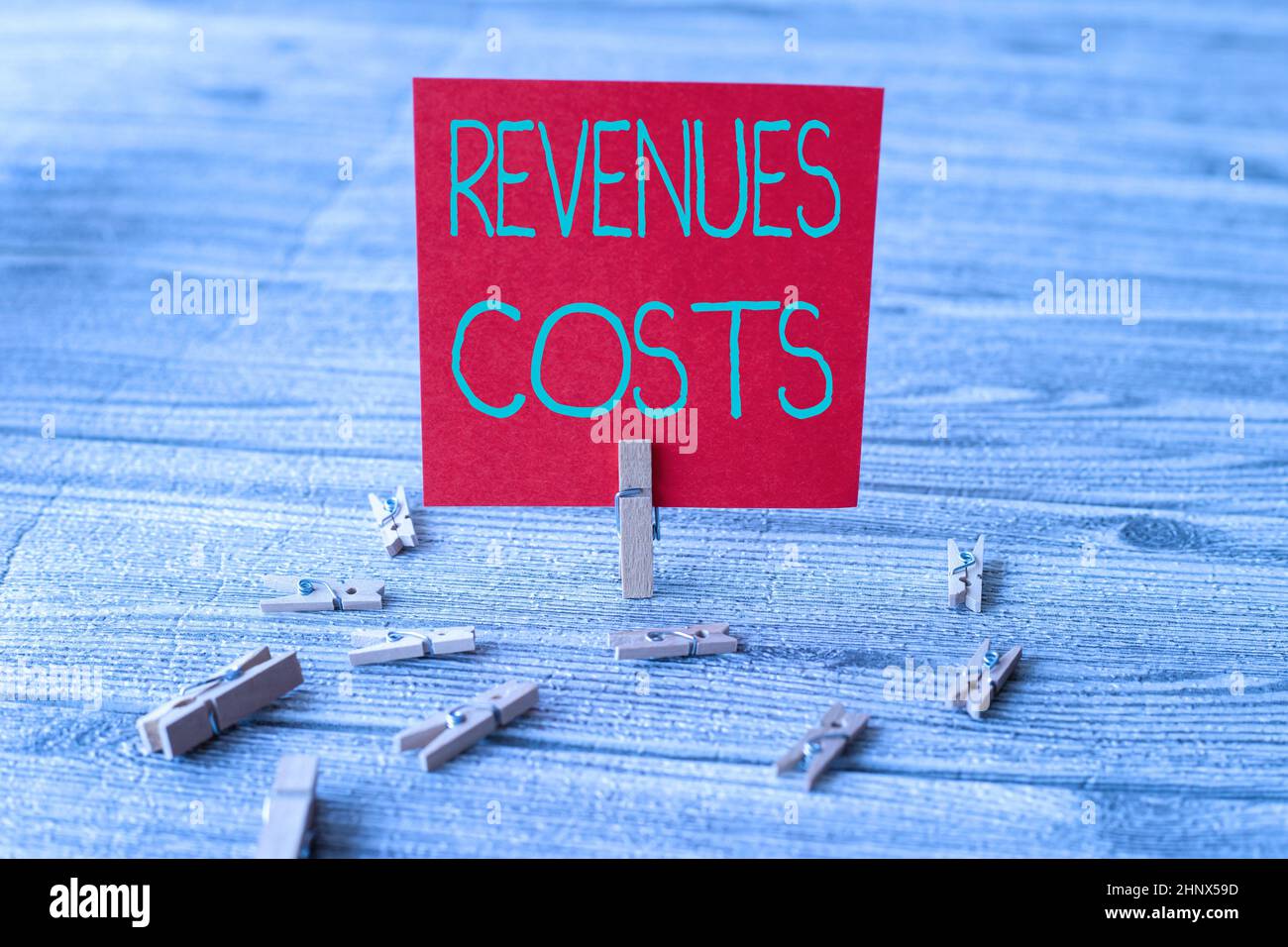 Inspiration showing sign Revenues Costs, Word for Total amount of money in Manufacturing and Delivery a product Piece Of Blank Square Note Surrounded Stock Photo