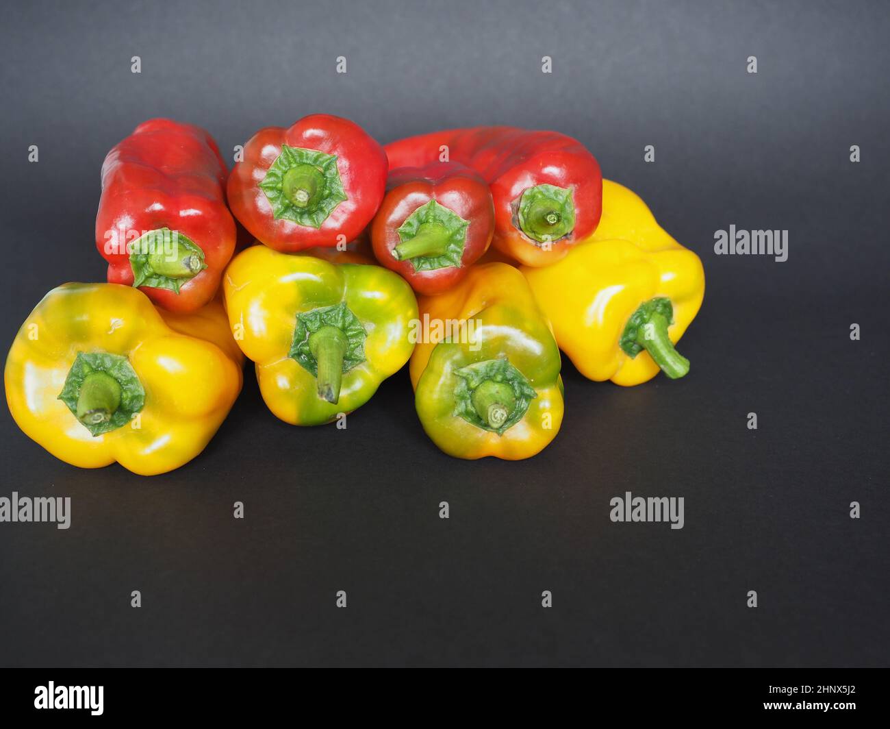red and yellow peppers (scientific name Capsicum aka bell peppers