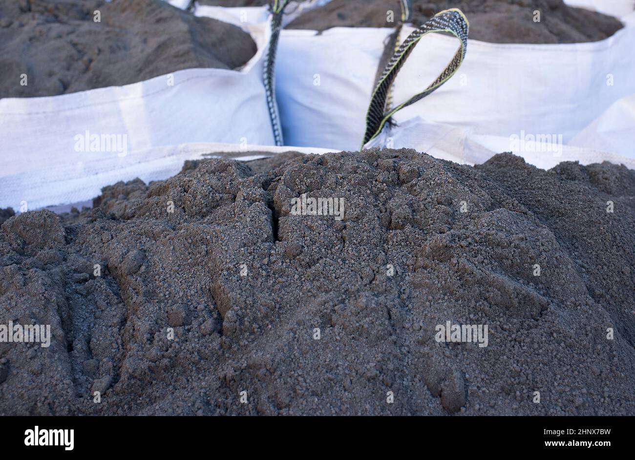 Raffia large sack of black topsoil. Selective focus Stock Photo