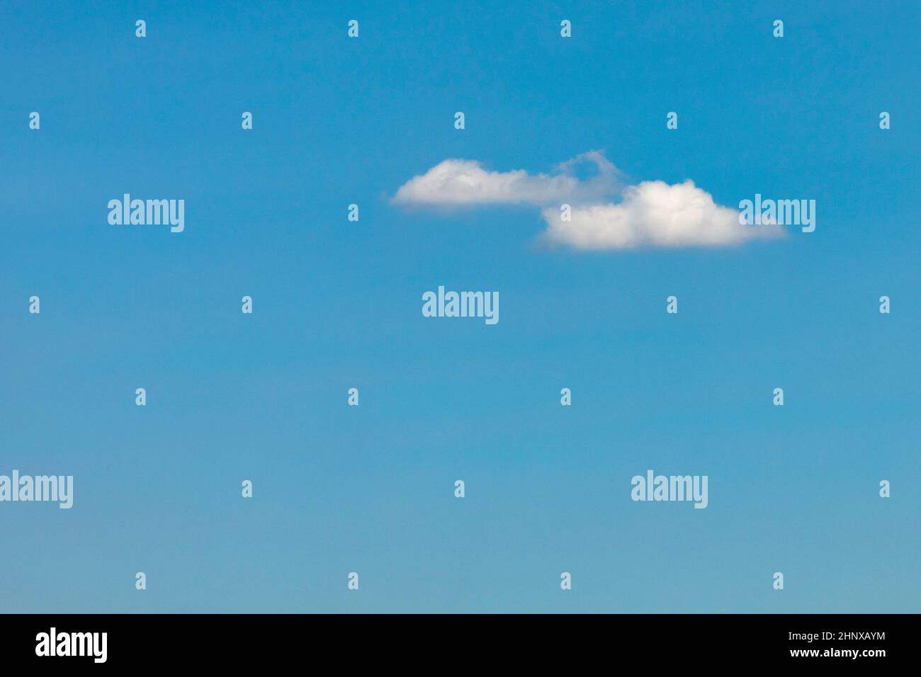 blue sky with one puffy white cloud Stock Photo - Alamy