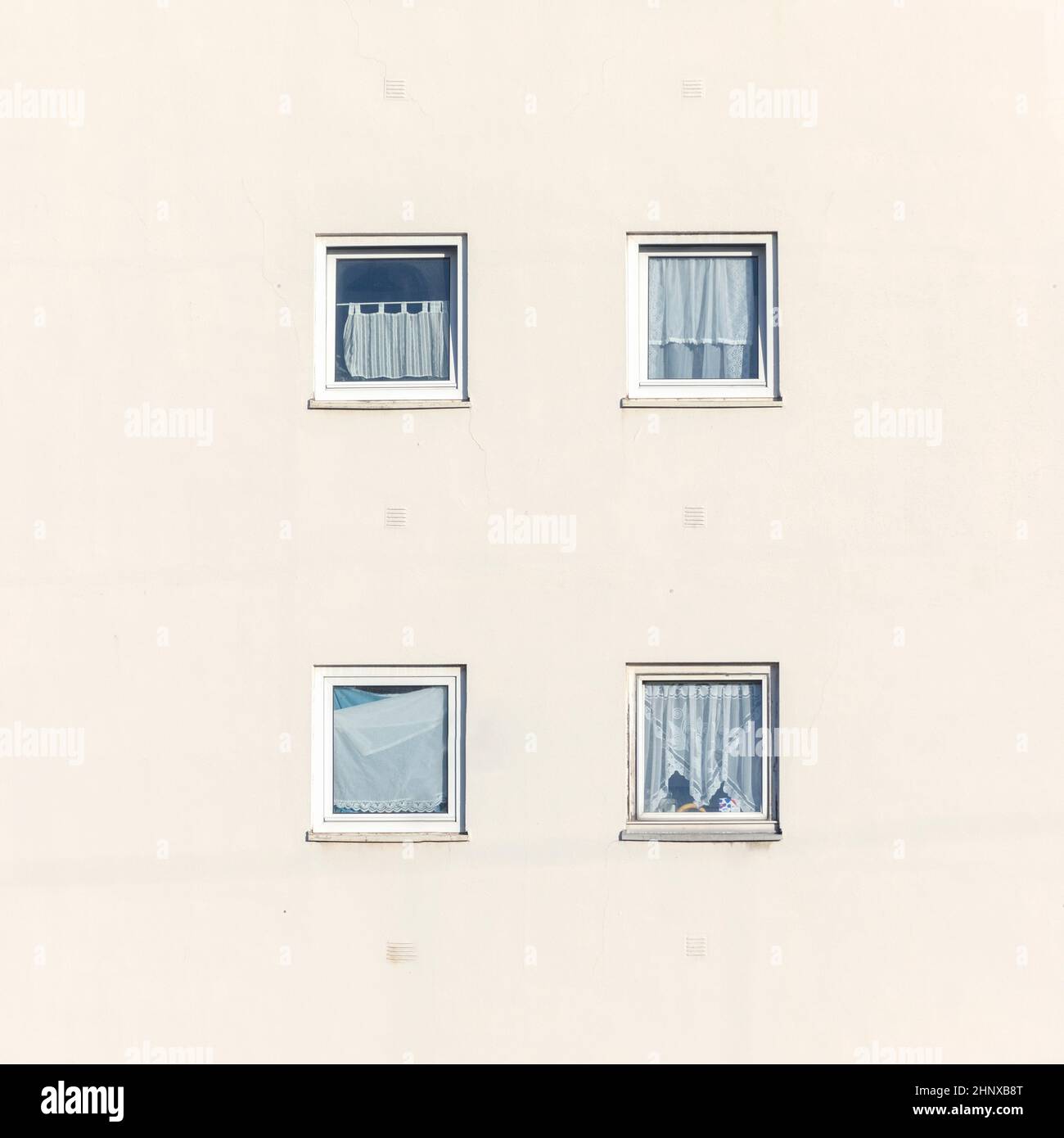 typical windows with curtains of an apartment house in Germany as ...