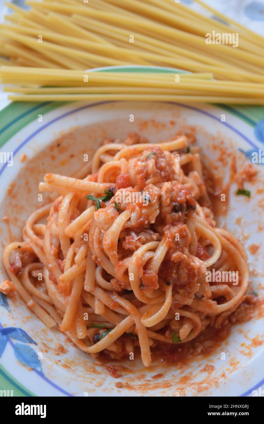 spaghetti alla puttanesca typical dish of Neapolitan cuisine Stock Photo