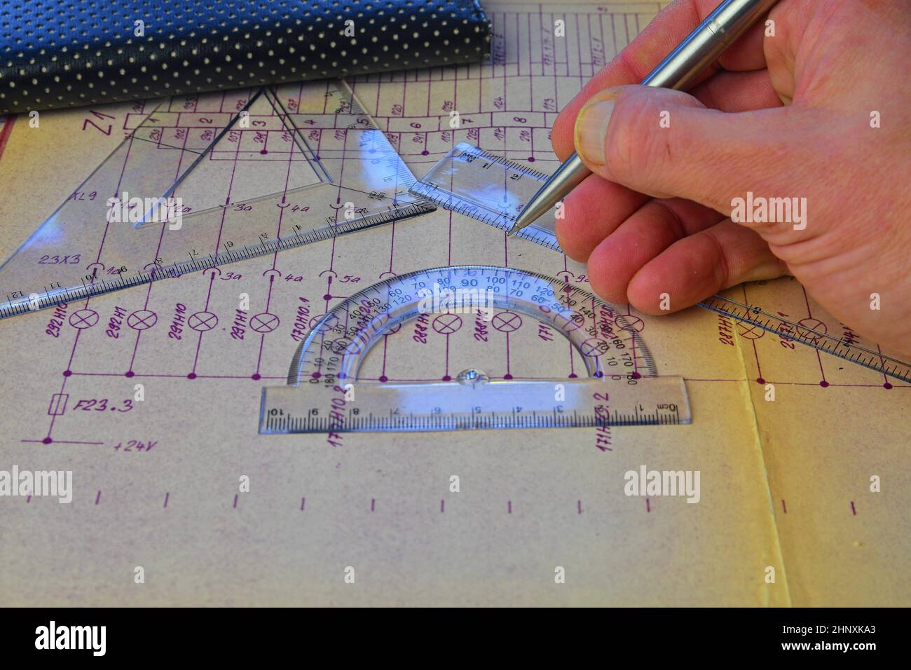 Electrical engineer workplace electrotechnical project, rulers, and