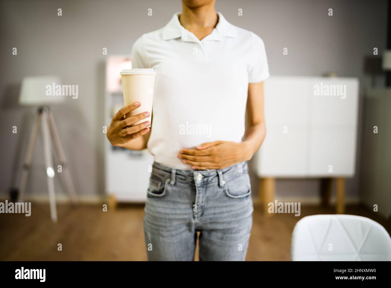 Coffee Stomach Ache. Digesting Acid Pain And Health Risk Stock Photo