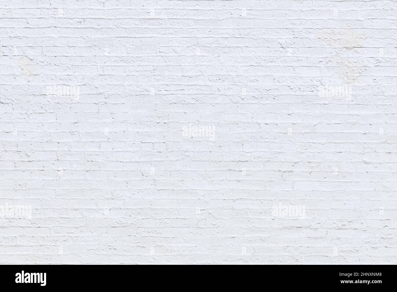 harmonic old brick wall painted in white as background Stock Photo