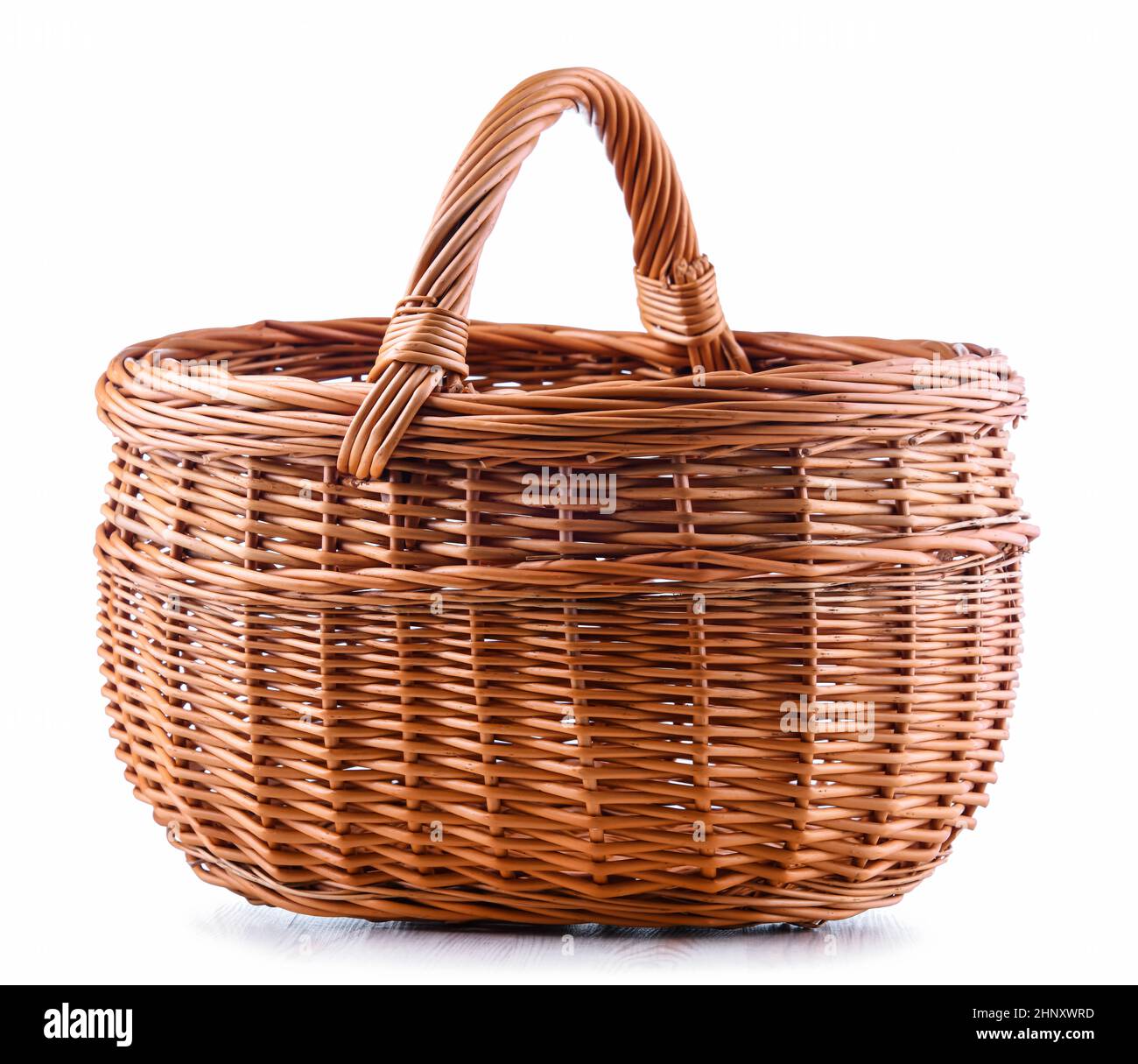 Empty wicker basket isolated on white background Stock Photo - Alamy