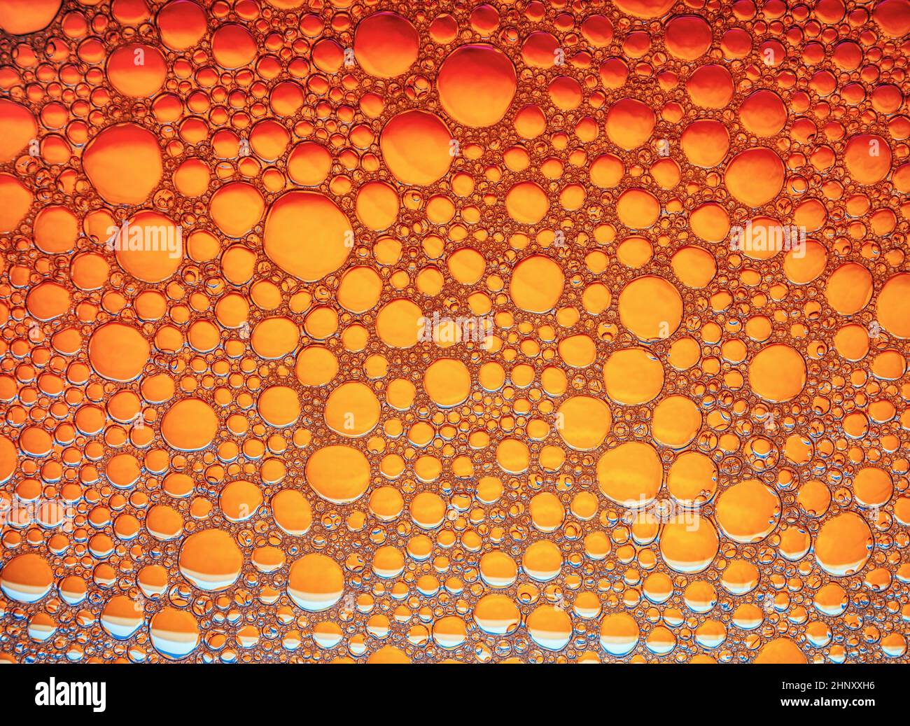 Orange bubbles background. Foam bubbles macro texture. Stock Photo