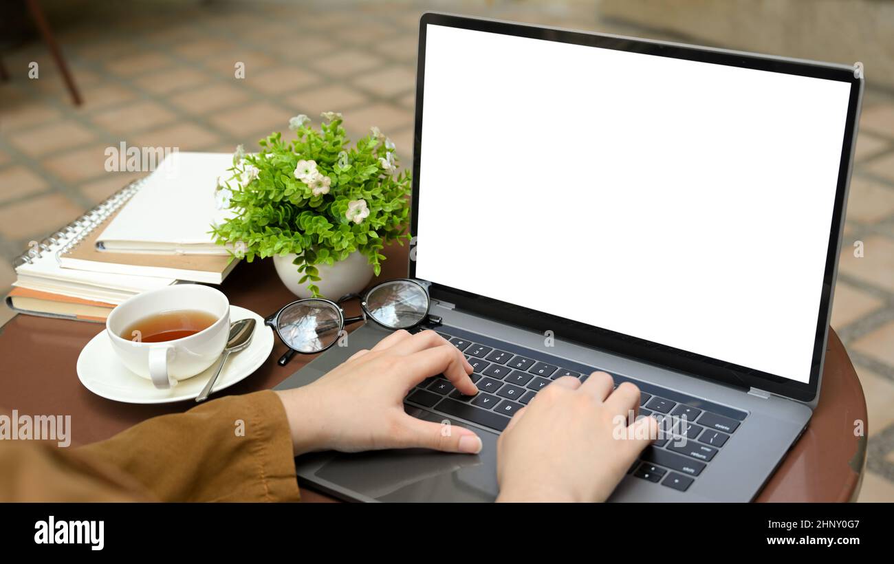 Writer With Computer Female freelance author typing on her laptop computer at the outside of ...