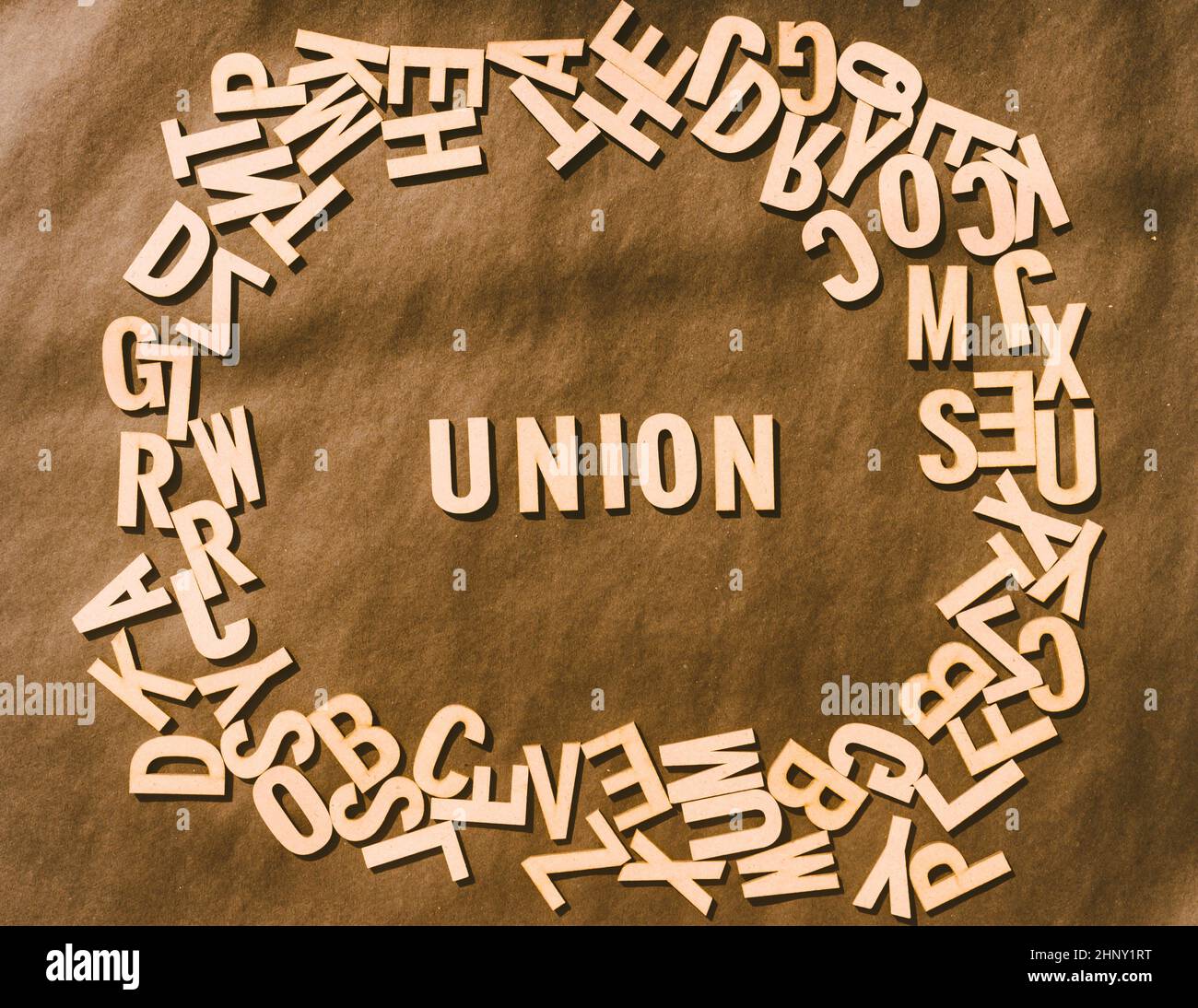 Unon Letters Union Word In Wooden Cube Alphabet Letters Top View On A rustic paper ...
