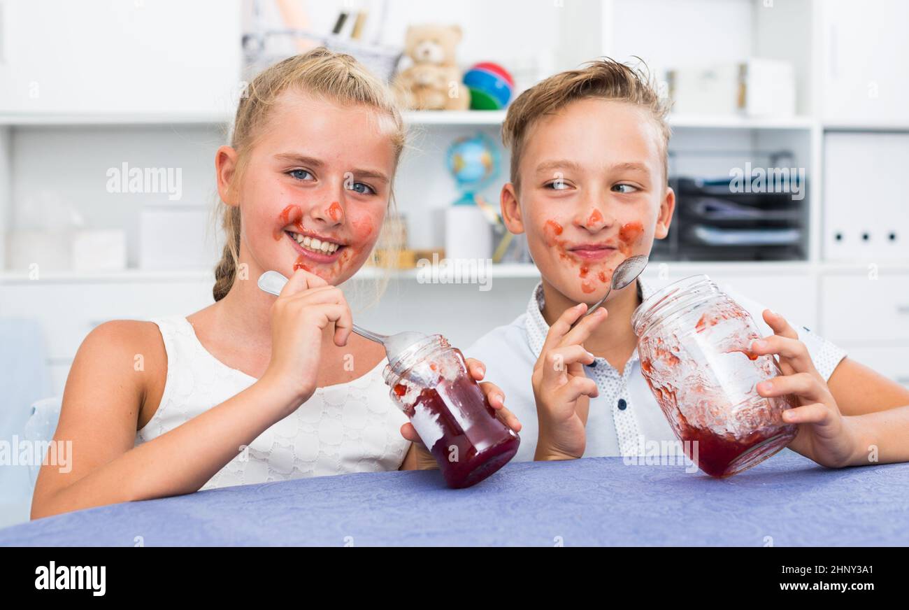 Girl and boy are eating jam Stock Photo Alamy