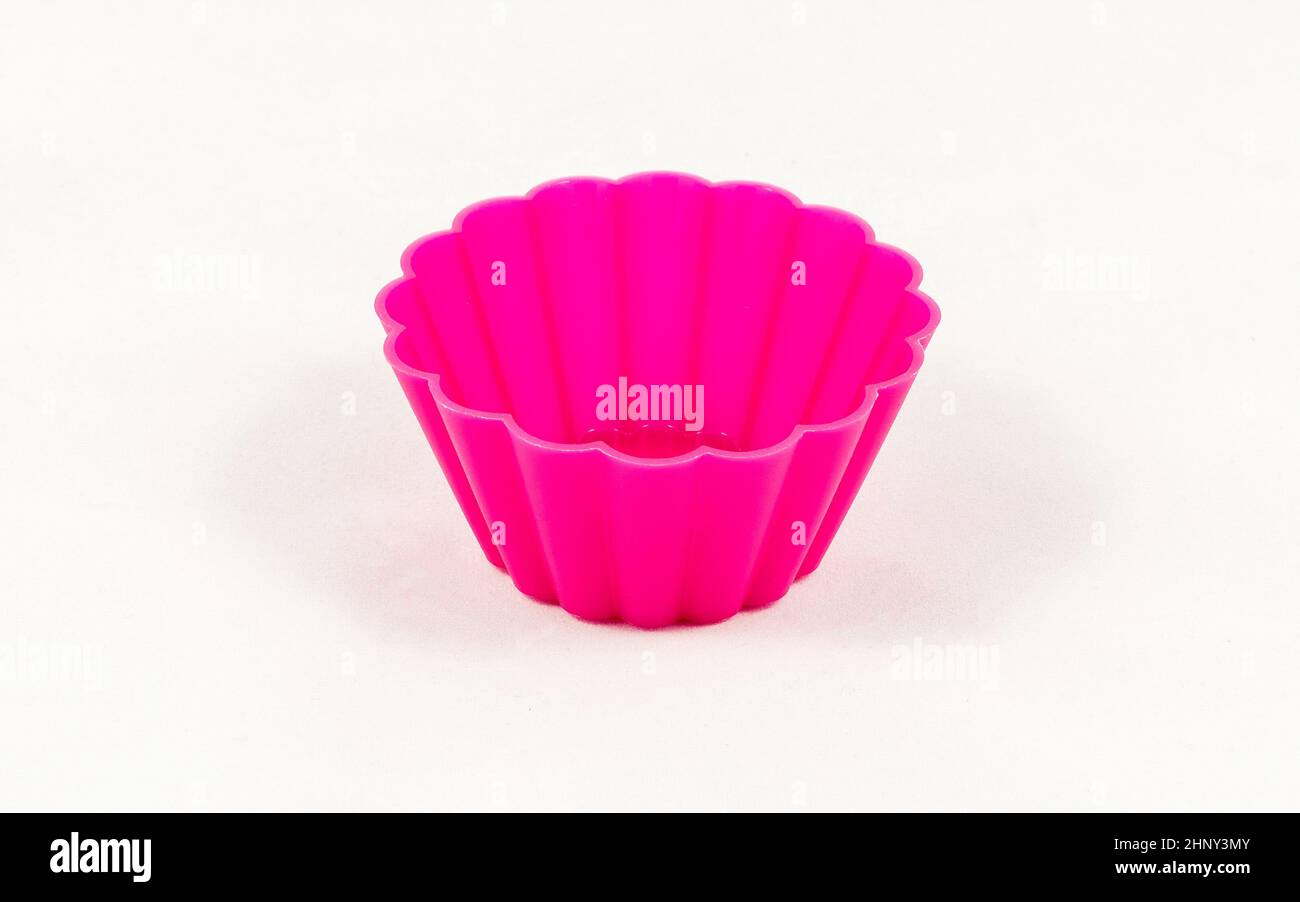 Pink silicone cake cups isolated on white background Stock Photo