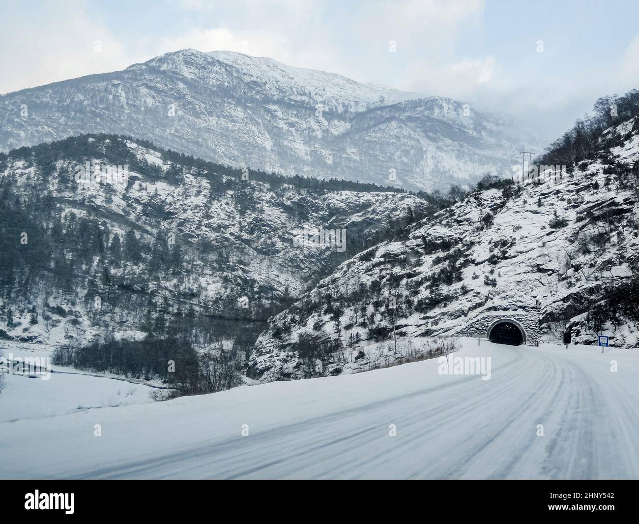 Tunnel in front of the road in a winter mountain landscape of Norway. Stock Photo
