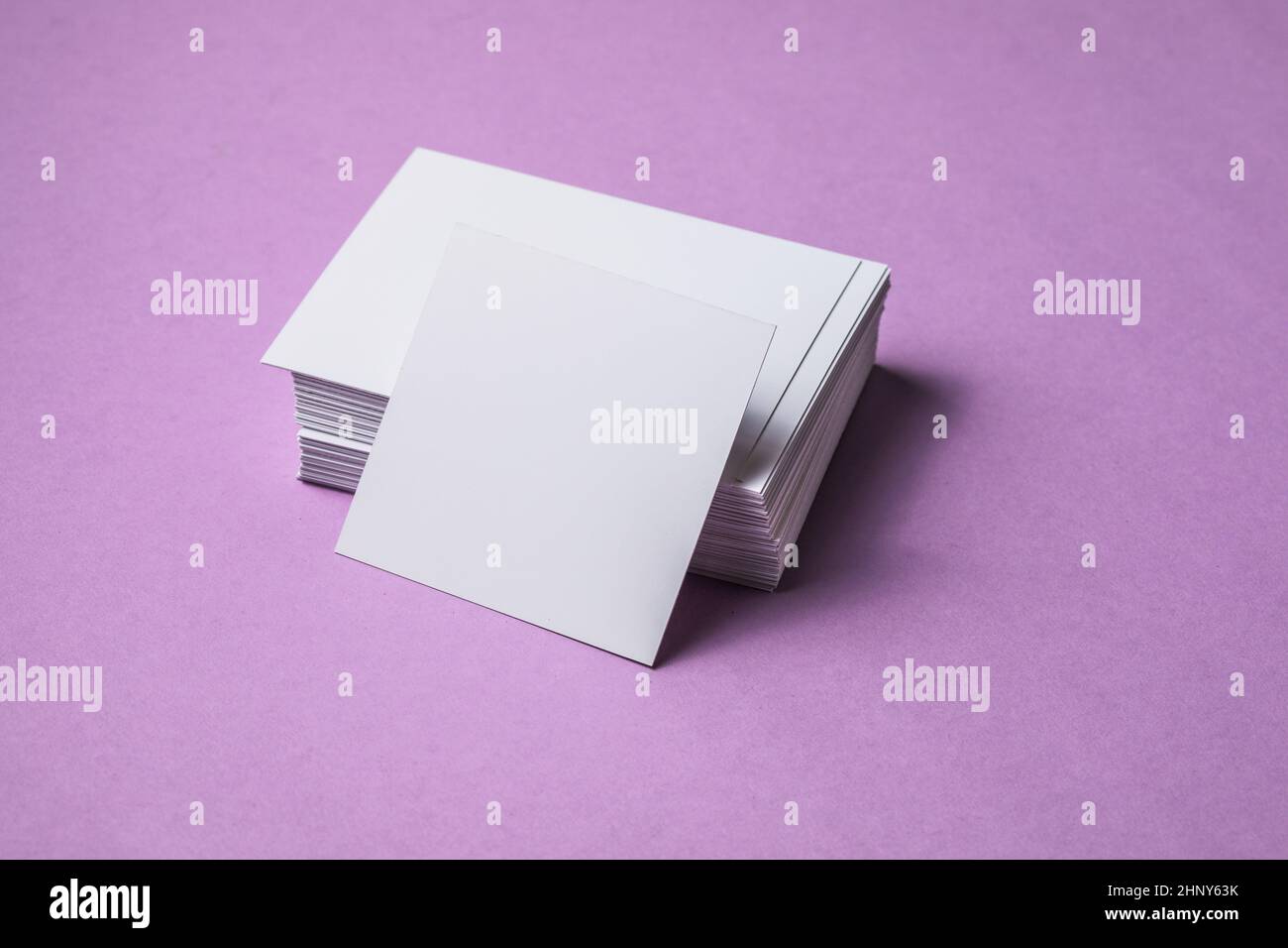 White sheet mockup. Stack of blank name cards. Blank white business