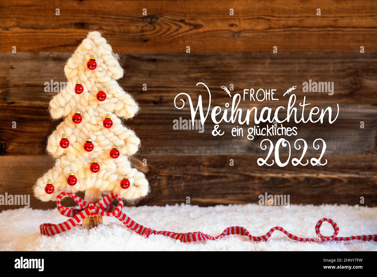 German Christmas 2022 German Calligraphy Frohe Weihnachten Und Ein Glueckliches 2022 Means Merry  Christmas And A Happy 2022. White Fabric Christmas Tree With Red Ball Ornam  Stock Photo - Alamy