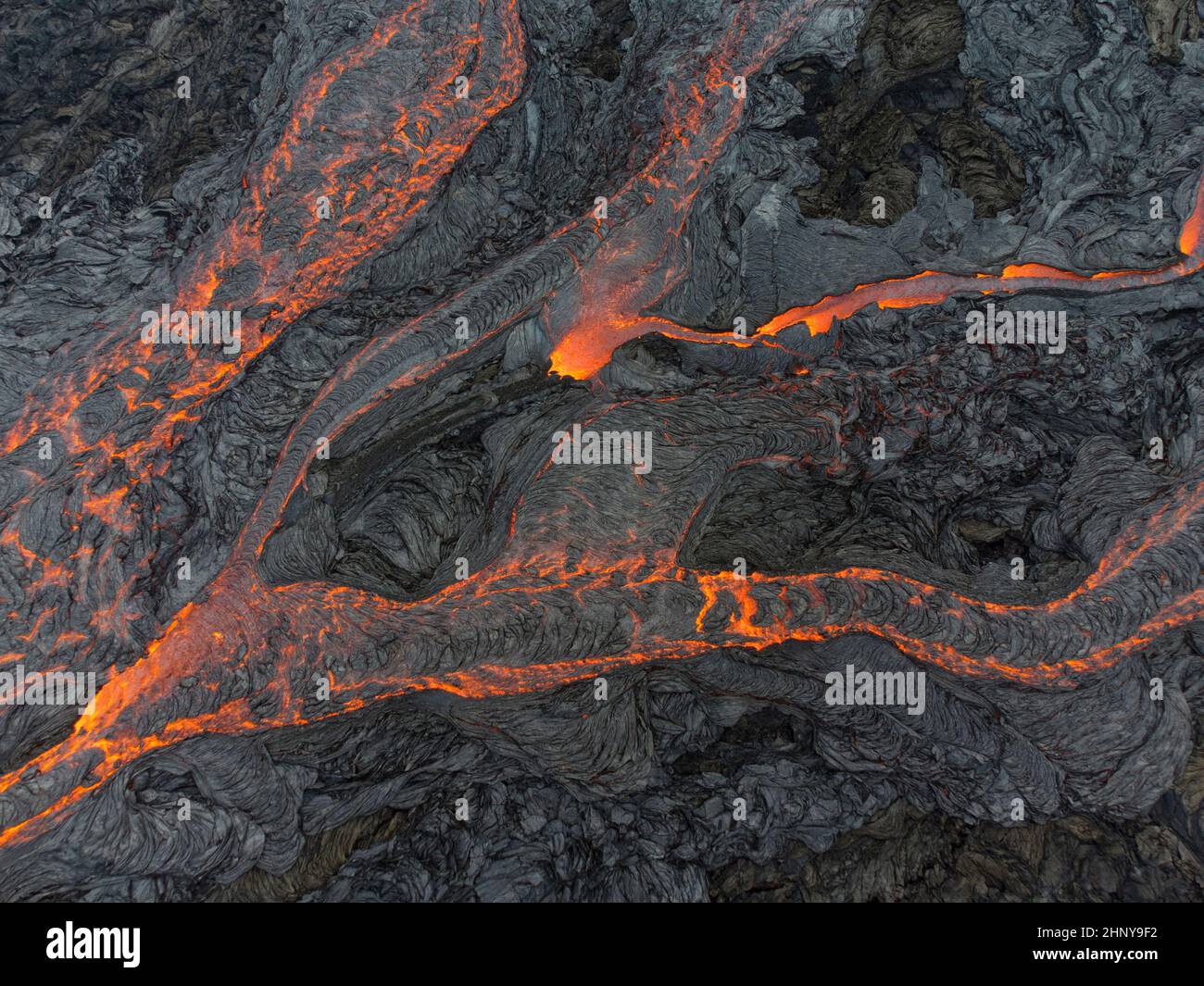 Droneshot of lava flowing down in different streams at Fagradalsfjall volcano, Iceland Stock Photo
