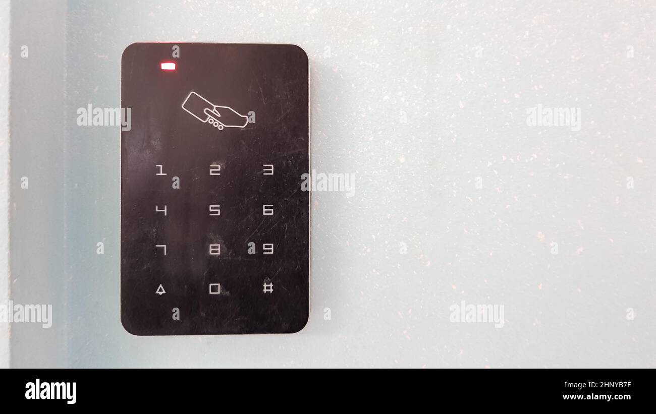 Electronic lock on the wall with copy space. Digital security systems for door security. Selective focus Stock Photo