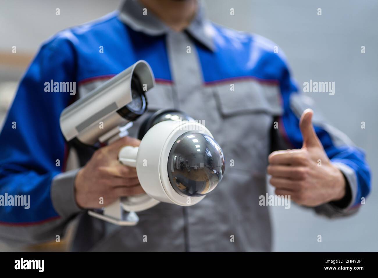 Technician Using Surveillance Security Camera Video System Stock Photo