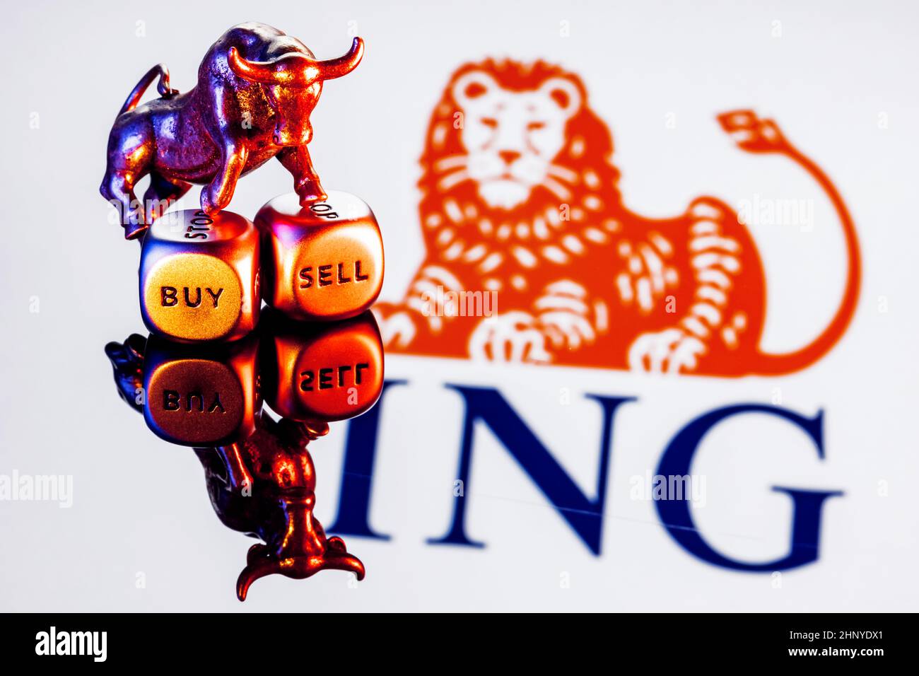 Metal bull stands on buy-sell dices on background of ING Group logo Stock  Photo - Alamy
