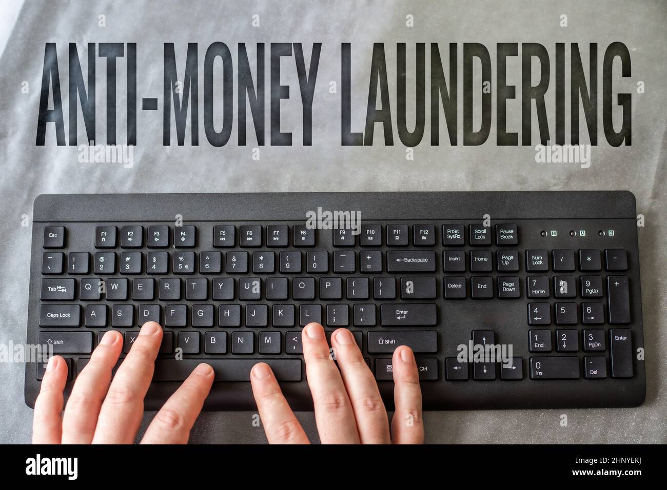 Writing displaying text Anti Money Laundering, Business idea regulations stop generating income through illegal actions Hands Pointing Pressing Comput Stock Photo
