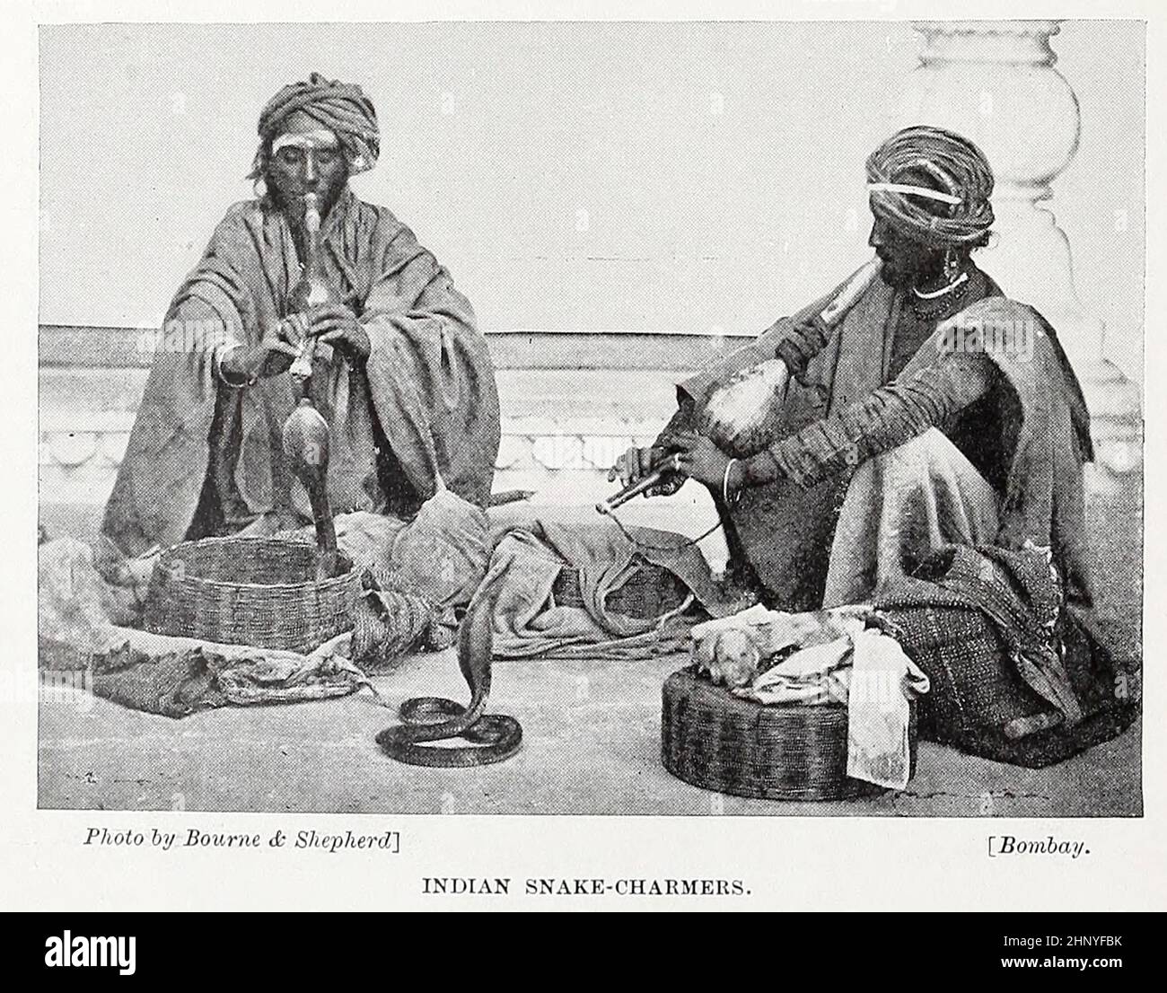 Indian snake-charmers from The living races of mankind : a popular illustrated account of the customs, habits, pursuits, feasts & ceremonies of the races of mankind throughout the world Volume 1 by Sir Harry Hamilton Johnston, Henry Neville Hutchinson, Richard Lydekker and Dr. A. H. Keane published London : Hutchinson & Co. 1902 Stock Photo