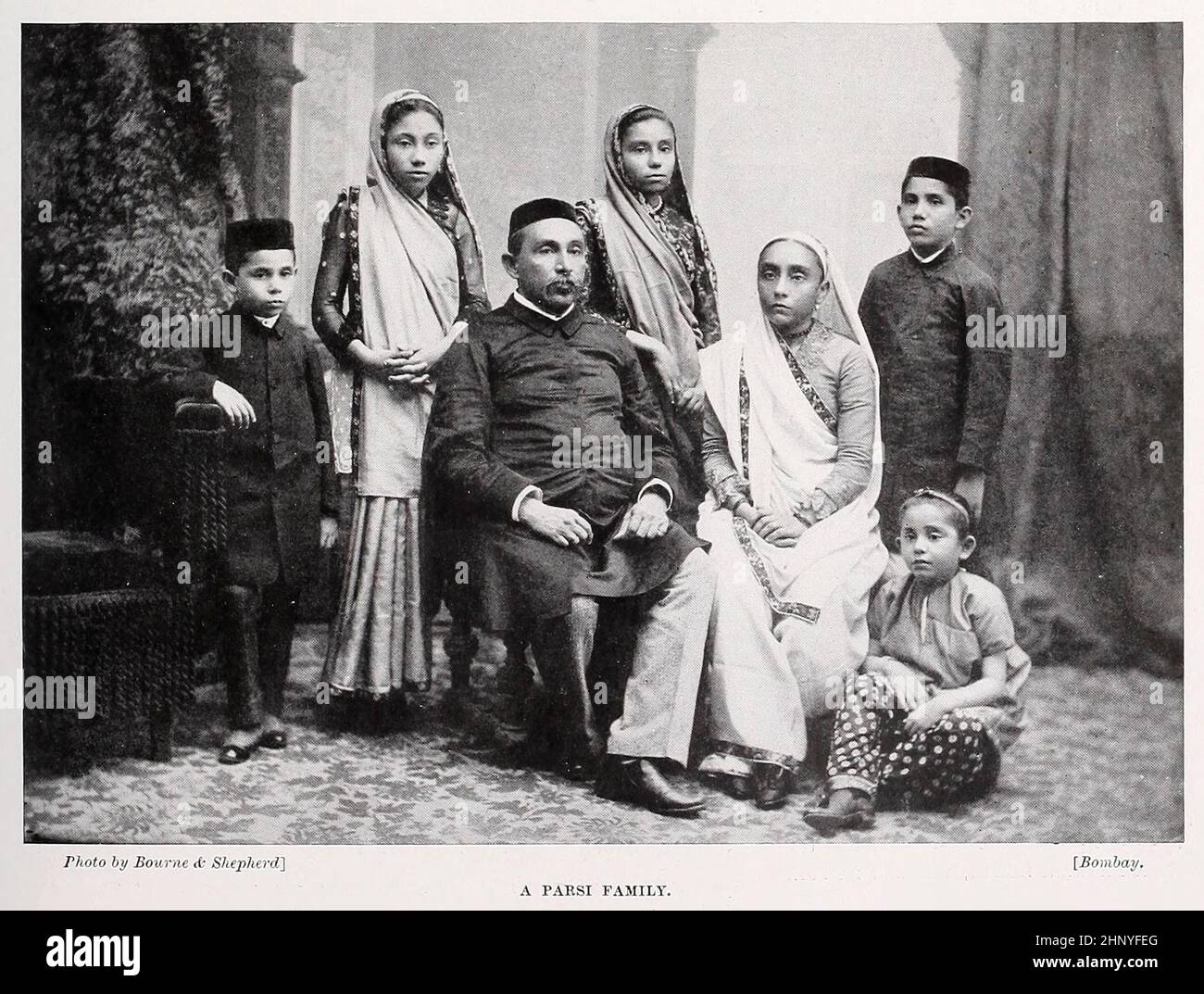 A Parsi family from The living races of mankind : a popular illustrated account of the customs, habits, pursuits, feasts & ceremonies of the races of mankind throughout the world Volume 1 by Sir Harry Hamilton Johnston, Henry Neville Hutchinson, Richard Lydekker and Dr. A. H. Keane published London : Hutchinson & Co. 1902 Stock Photo