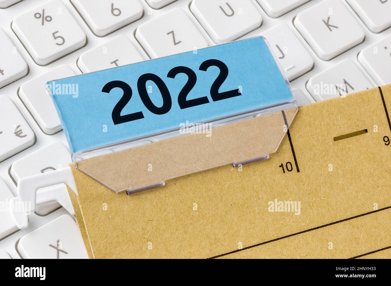 A brown file folder labeled with 2022 Stock Photo
