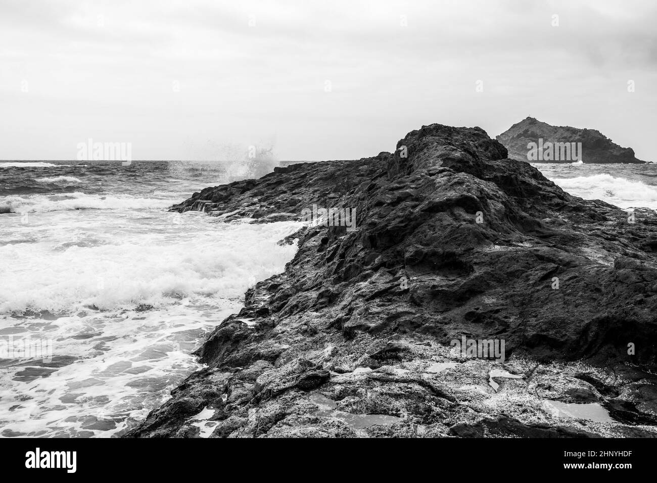 Rocky Coast And Splashing Ocean Waves. Black And White Stock Photo - Alamy