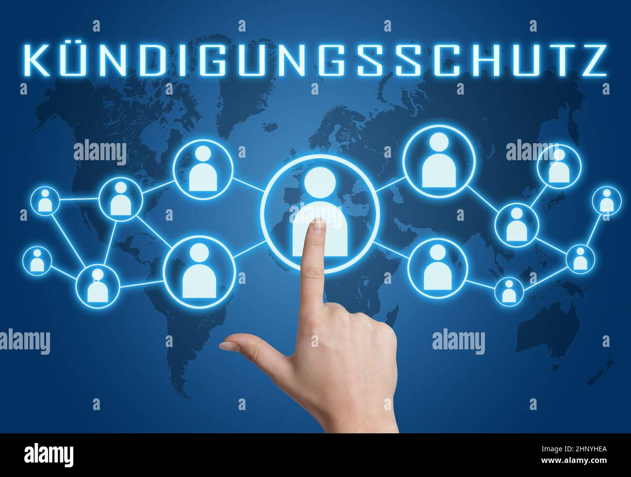 Kuendigungsschutz - german word for protection against dismissal - text concept with hand pressing social icons on blue world map background. Stock Photo