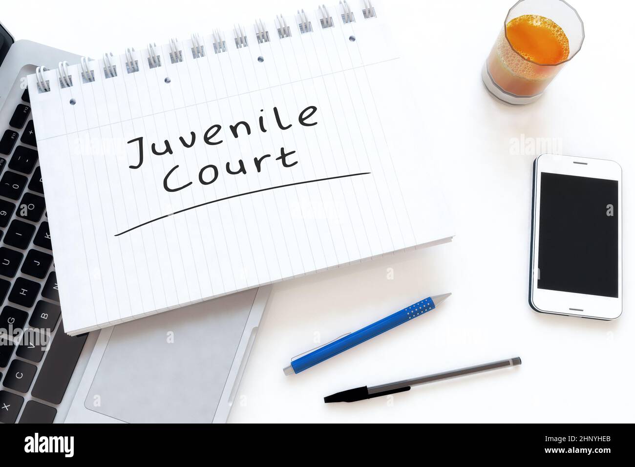 Juvenile Court - handwritten text in a notebook on a desk - 3d render illustration. Stock Photo